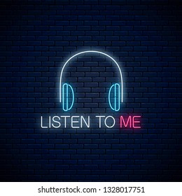 Glowing neon sign with headphones and listen to me slogan on dark brick wall background. Call to listen symbol with cheering inscription. Vector illustration.