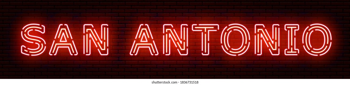 Glowing neon sign with the inscription of the USA city of San Antonio. In red and orange colors. Against a brick wall. All elements are isolated.