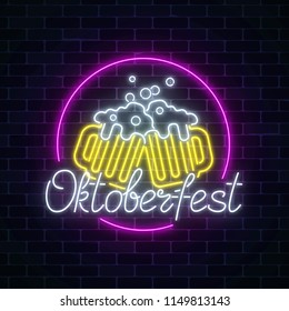 Glowing neon sign of octoberfest festival with two beer mugs on dark brick wall background. Beer fest logo. Vector illustration.