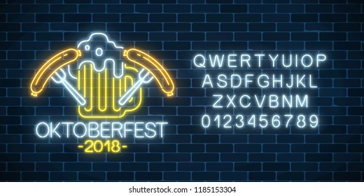 Glowing neon sign of oktoberfest festival with beer mug, sausages and alphabet on dark brick wall background. Beer fest logo. Vector illustration.