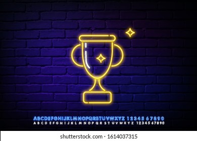 A glowing neon sign with a reward Cup against a dark brick wall. Winner's Cup honorary trophy neon symbol. Vector illustration with neon letters.