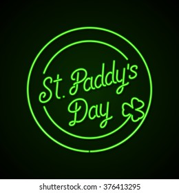 Glowing neon sign - St. Paddy's Day lettering with shamrock on a dark green background.