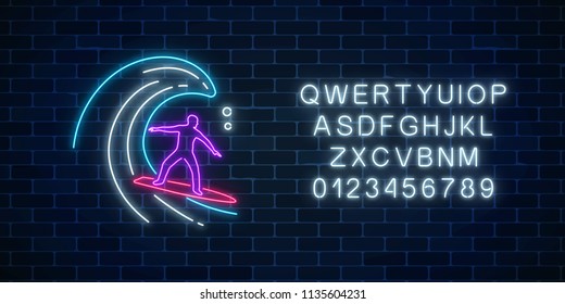 Glowing neon sign of surfer in ocean wave with alphabet on dark brick wall background. Man on surfboard on waves. Symbol of summer leisure on vacation. Vector illustration.