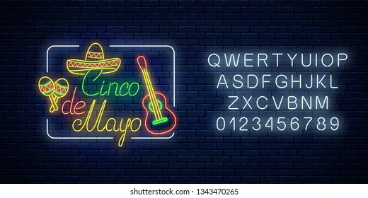 Glowing neon sinco de mayo holiday sign in rectangle frame with alphabet on dark brick wall background. Mexican festival flyer design with guitar, maracas and sombrero hat. Vector illustration.