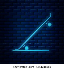 Glowing neon Skateboard icon isolated on brick wall background. Extreme sport. Sport equipment.  Vector Illustration