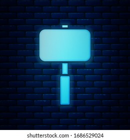 Glowing neon Sledgehammer icon isolated on brick wall background.  Vector Illustration