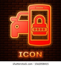 Glowing neon Smart car security system icon isolated on brick wall background. The smartphone controls the car security on the wireless.  Vector Illustration
