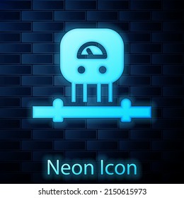 Glowing neon Smart sensor system icon isolated on brick wall background. Internet of things concept with wireless connection. Vector