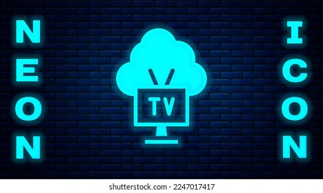Glowing neon Smart Tv icon isolated on brick wall background. Television sign.  Vector