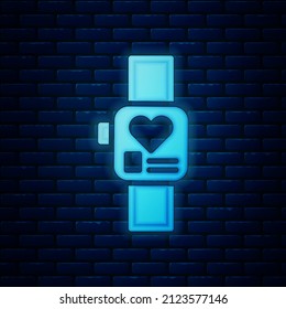 Glowing neon Smart watch showing heart beat rate icon isolated on brick wall background. Fitness App concept.  Vector