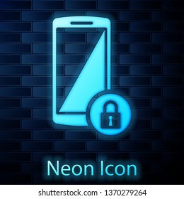 Glowing neon Smartphone with closed padlock icon isolated on brick wall background. Phone with lock. Mobile security, safety, protection concept. Vector Illustration