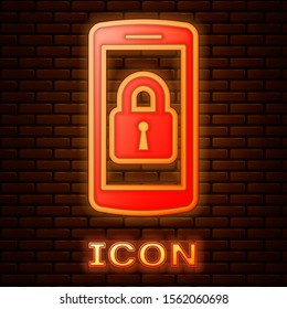Glowing neon Smartphone with closed padlock icon isolated on brick wall background. Phone with lock. Mobile security, safety, protection concept.  Vector Illustration