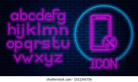 Glowing neon Smartphone with screwdriver and wrench icon isolated on brick wall background. Adjusting, service, setting, maintenance, repair, fixing. Neon light alphabet. Vector Illustration