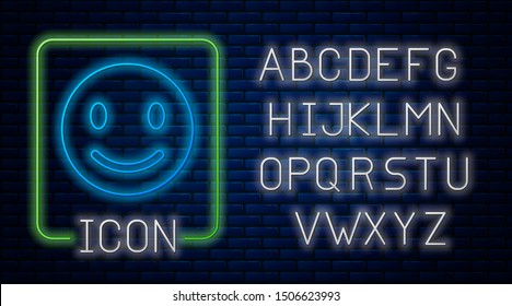 Glowing neon Smile face icon isolated on brick wall background. Smiling emoticon. Happy chat symbol. Neon light alphabet. Vector Illustration