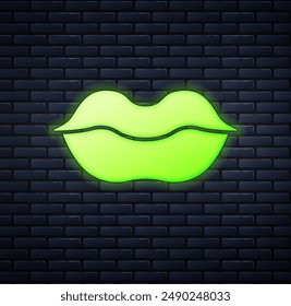 Glowing neon Smiling lips icon isolated on brick wall background. Smile symbol.  Vector