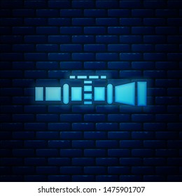 Glowing neon Sniper optical sight icon isolated on brick wall background. Sniper scope crosshairs.  Vector Illustration