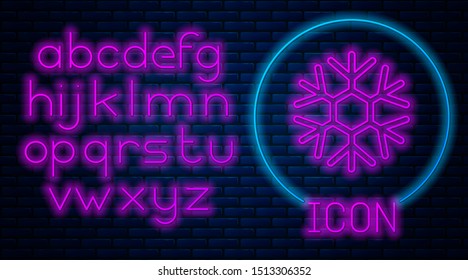 Glowing neon Snowflake icon isolated on brick wall background. Neon light alphabet. Vector Illustration