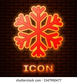 Glowing neon Snowflake icon isolated on brick wall background.  Vector Illustration