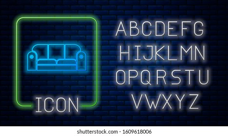 Glowing neon Sofa icon isolated on brick wall background. Neon light alphabet. Vector Illustration