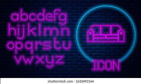 Glowing neon Sofa icon isolated on brick wall background. Neon light alphabet. Vector Illustration