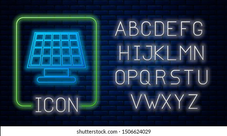 Glowing neon Solar energy panel icon isolated on brick wall background. Neon light alphabet. Vector Illustration