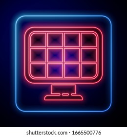 Glowing neon Solar energy panel icon isolated on blue background.  Vector Illustration