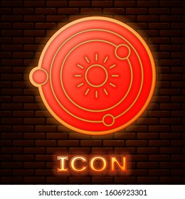 Glowing neon Solar system icon isolated on brick wall background. The planets revolve around the star.  Vector Illustration