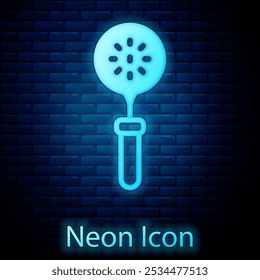 Glowing neon Spatula icon isolated on brick wall background. Kitchen spatula icon. BBQ spatula sign. Barbecue and grill tool.  Vector