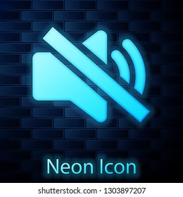 Glowing neon Speaker mute icon isolated on brick wall background. No sound icon. Volume Off symbol. Vector Illustration