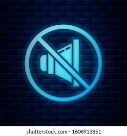 Glowing neon Speaker mute icon isolated on brick wall background. No sound icon. Volume Off symbol.  Vector Illustration