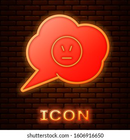 Glowing neon Speech bubble with angry smile icon isolated on brick wall background. Emoticon face.  Vector Illustration