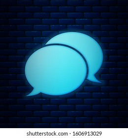 Glowing neon Speech bubble chat icon isolated on brick wall background. Message icon. Communication or comment chat symbol.  Vector Illustration