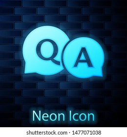 Glowing neon Speech bubbles with Question and Answer icon isolated on brick wall background. Q and A symbol. FAQ sign. Chat speech bubble and chart.  Vector Illustration