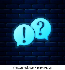 Glowing neon Speech bubbles with Question and Exclamation marks icon isolated on brick wall background. FAQ sign. Copy files, chat speech bubble and chart web icons.  Vector Illustration