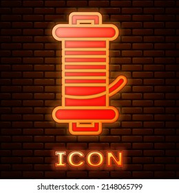Glowing neon Spinning reel for fishing icon isolated on brick wall background. Fishing coil. Fishing tackle. Vector