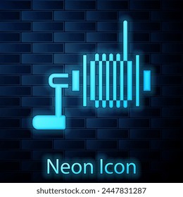 Glowing neon Spinning reel for fishing icon isolated on brick wall background. Fishing coil. Fishing tackle.  Vector