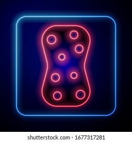 Glowing neon Sponge with bubbles icon isolated on blue background. Wisp of bast for washing dishes. Cleaning service logo.  Vector Illustration