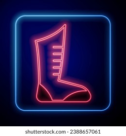 Glowing neon Sport boxing shoes icon isolated on black background. Wrestling shoes.  Vector