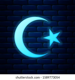 Glowing neon Star and crescent - symbol of Islam icon isolated on brick wall background. Religion symbol.  Vector Illustration
