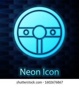 Glowing neon Steering wheel icon isolated on brick wall background. Car wheel icon.  Vector Illustration