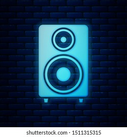 Glowing neon Stereo speaker icon isolated on brick wall background. Sound system speakers. Music icon. Musical column speaker bass equipment.  Vector Illustration
