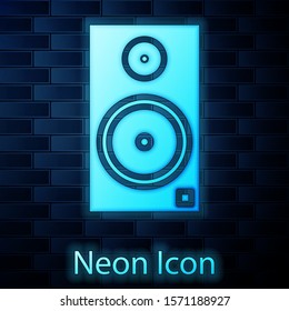 Glowing neon Stereo speaker icon isolated on brick wall background. Sound system speakers. Music icon. Musical column speaker bass equipment.  Vector Illustration