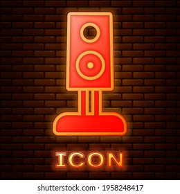 Glowing neon Stereo speaker icon isolated on brick wall background. Sound system speakers. Music icon. Musical column speaker bass equipment. Vector