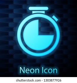Glowing neon Stopwatch icon isolated on brick wall background. Time timer sign. Vector Illustration