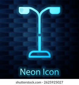 Glowing neon Street light system icon isolated on brick wall background.  Vector