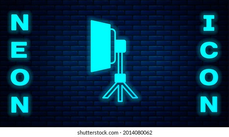 Glowing neon Studio light bulb in softbox icon isolated on brick wall background. Shadow reflection design.  Vector