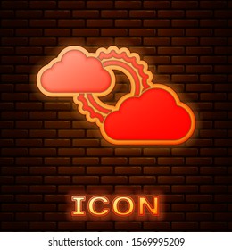 Glowing neon Sun and cloud weather icon isolated on brick wall background.  Vector Illustration