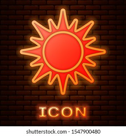 Glowing neon Sun icon isolated on brick wall background.  Vector Illustration
