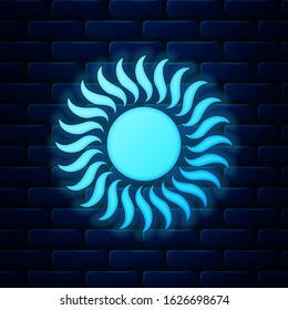 Glowing neon Sun icon isolated on brick wall background.  Vector Illustration