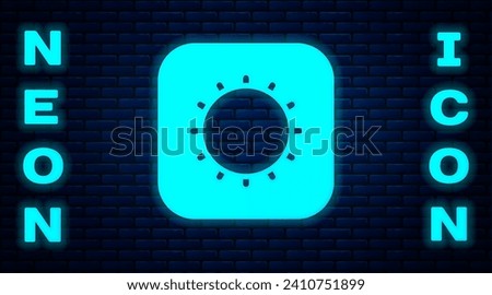 Glowing neon Sun icon isolated on brick wall background.  Vector